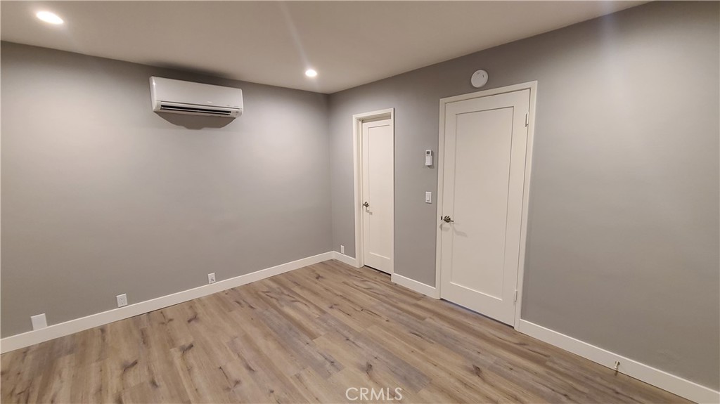 215 Lower Cliff Drive, Unit B Laguna Beach, CA 92651 - Photo 6 of 17 a view of an empty room with wooden floor