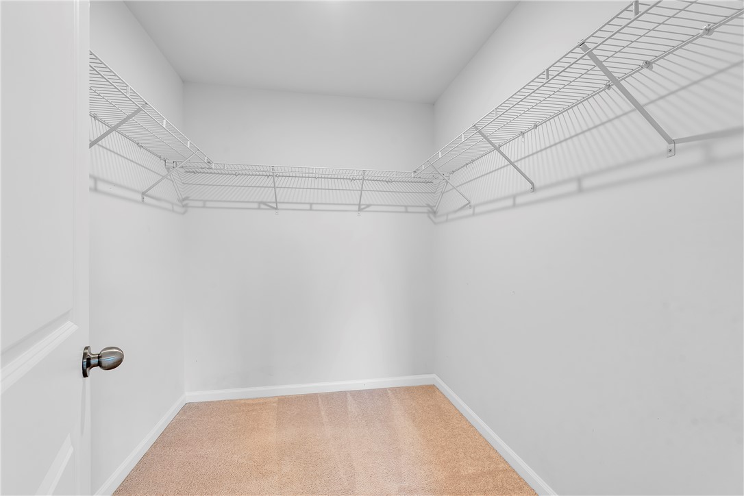 8 Leander Drive Greer, SC 29651 - Photo 26 of 31 A spacious walk-in closet with ample wire shelving for organized storage.