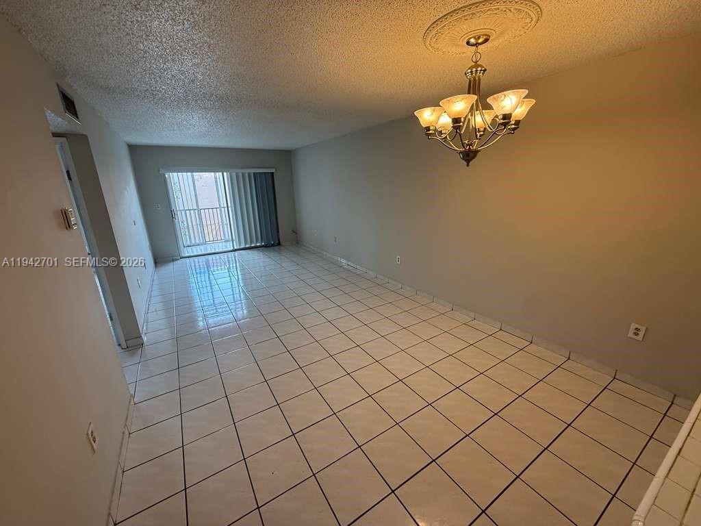 305 West 68th Street, Unit 519 Hialeah, FL 33014 - Photo 4 of 11 a view of a livingroom with window