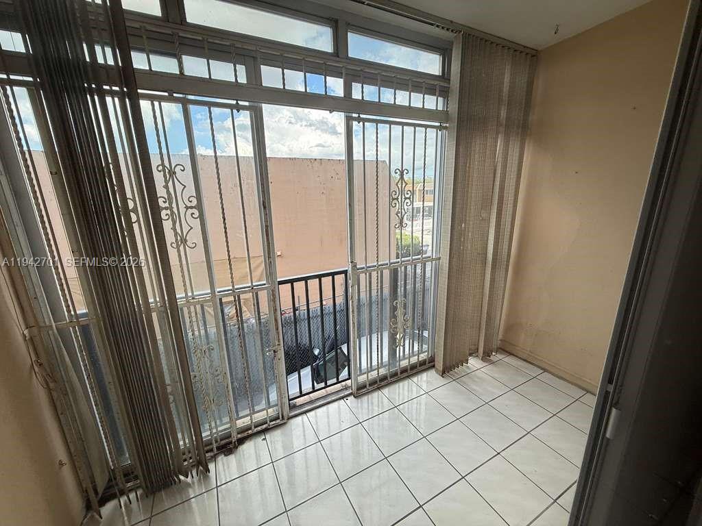305 West 68th Street, Unit 519 Hialeah, FL 33014 - Photo 9 of 11 a view of a porch