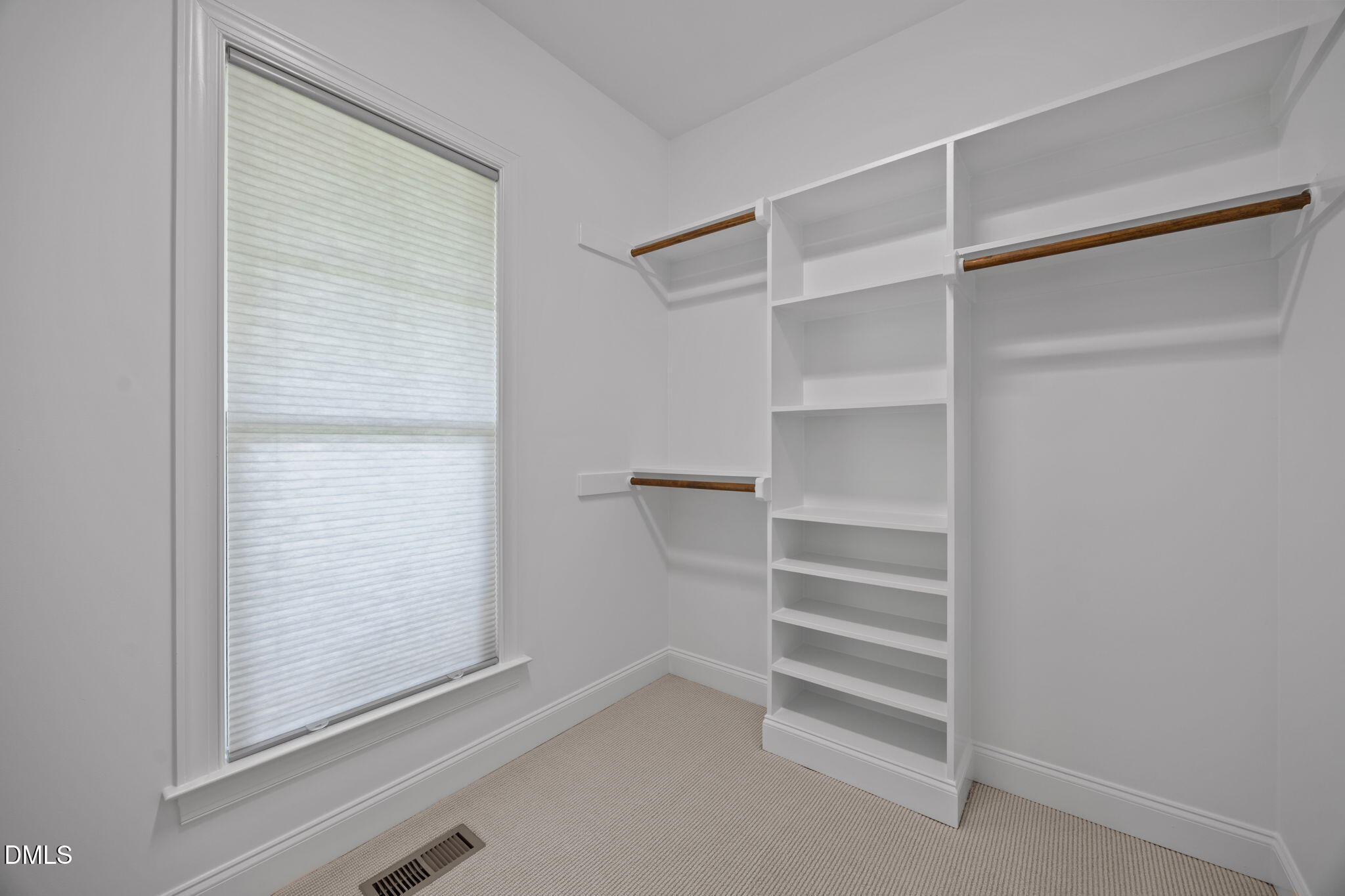 804 Hartford Road Raleigh, NC 27610 - Photo 14 of 26 a view of walk in closet with empty racks