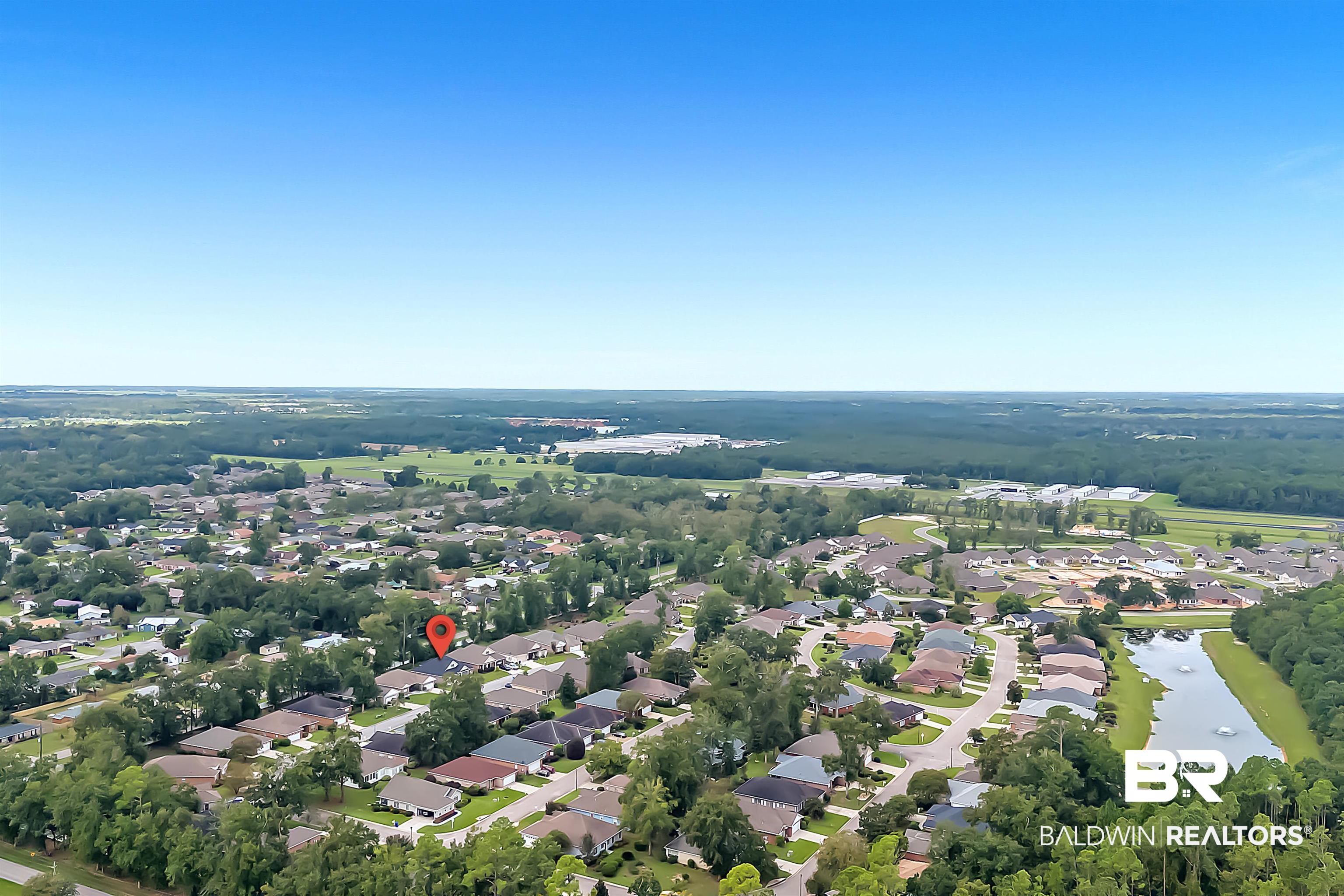 185 Mark Twain Loop Foley, AL 36535 - Photo 45 of 54 Drone / aerial view with a water view