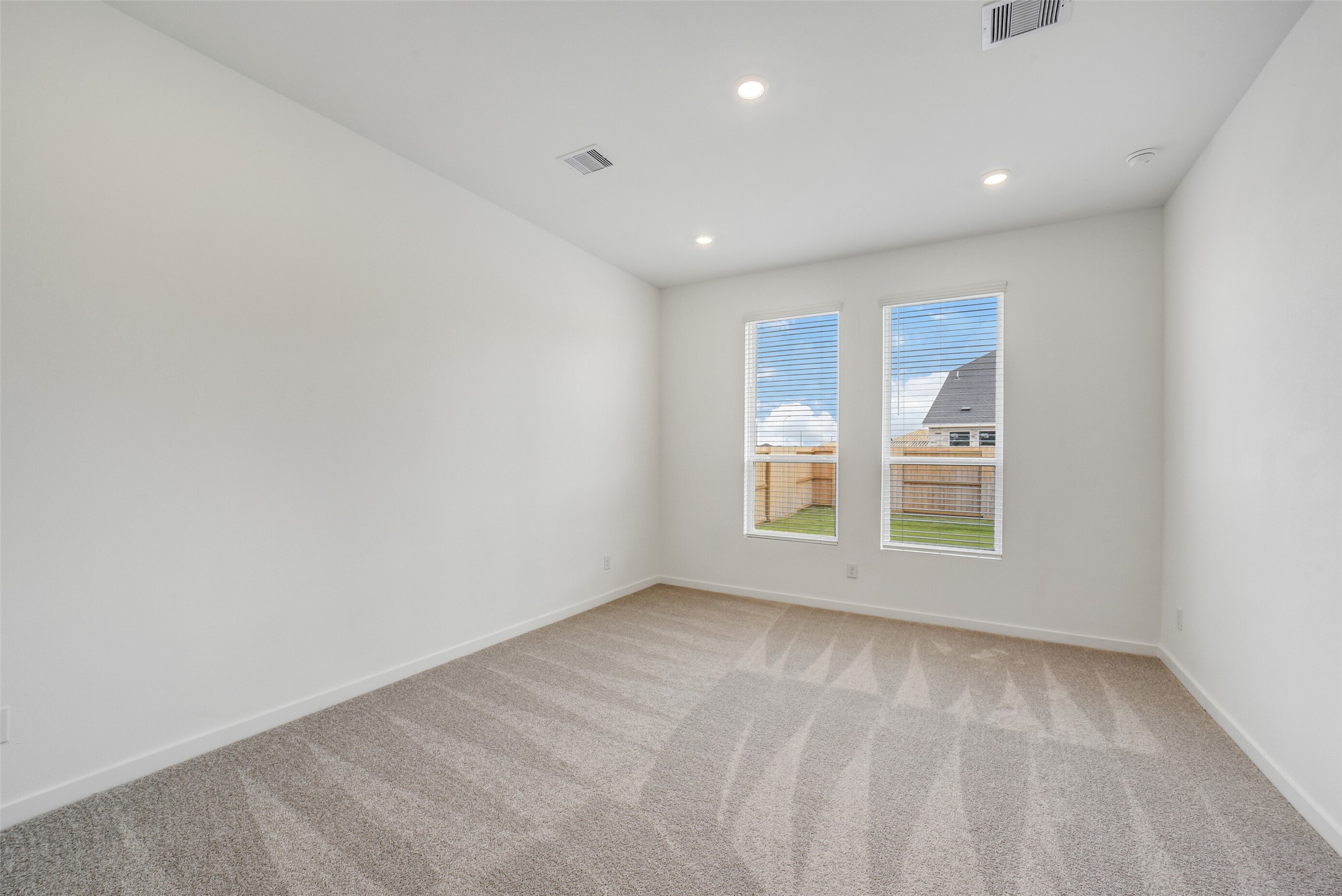 31111 Marlow Mnr Court Fulshear, TX 77441 - Photo 15 of 34 an empty room with a window