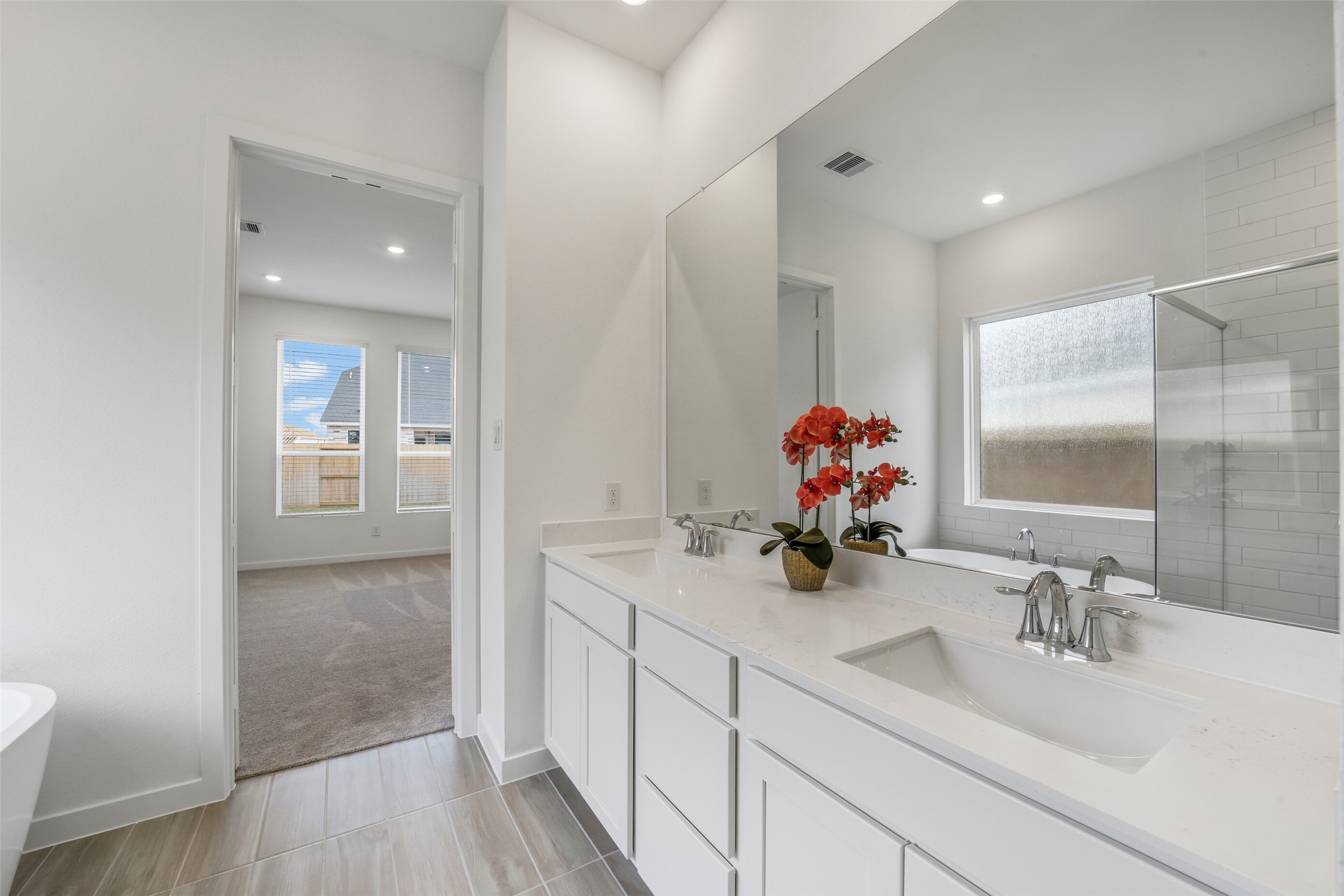 31111 Marlow Mnr Court Fulshear, TX 77441 - Photo 19 of 34 a bathroom with sink and mirror
