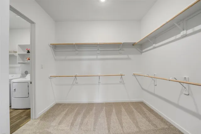 a view of an empty walk in closet