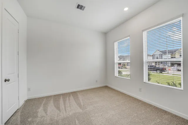 an empty room with windows