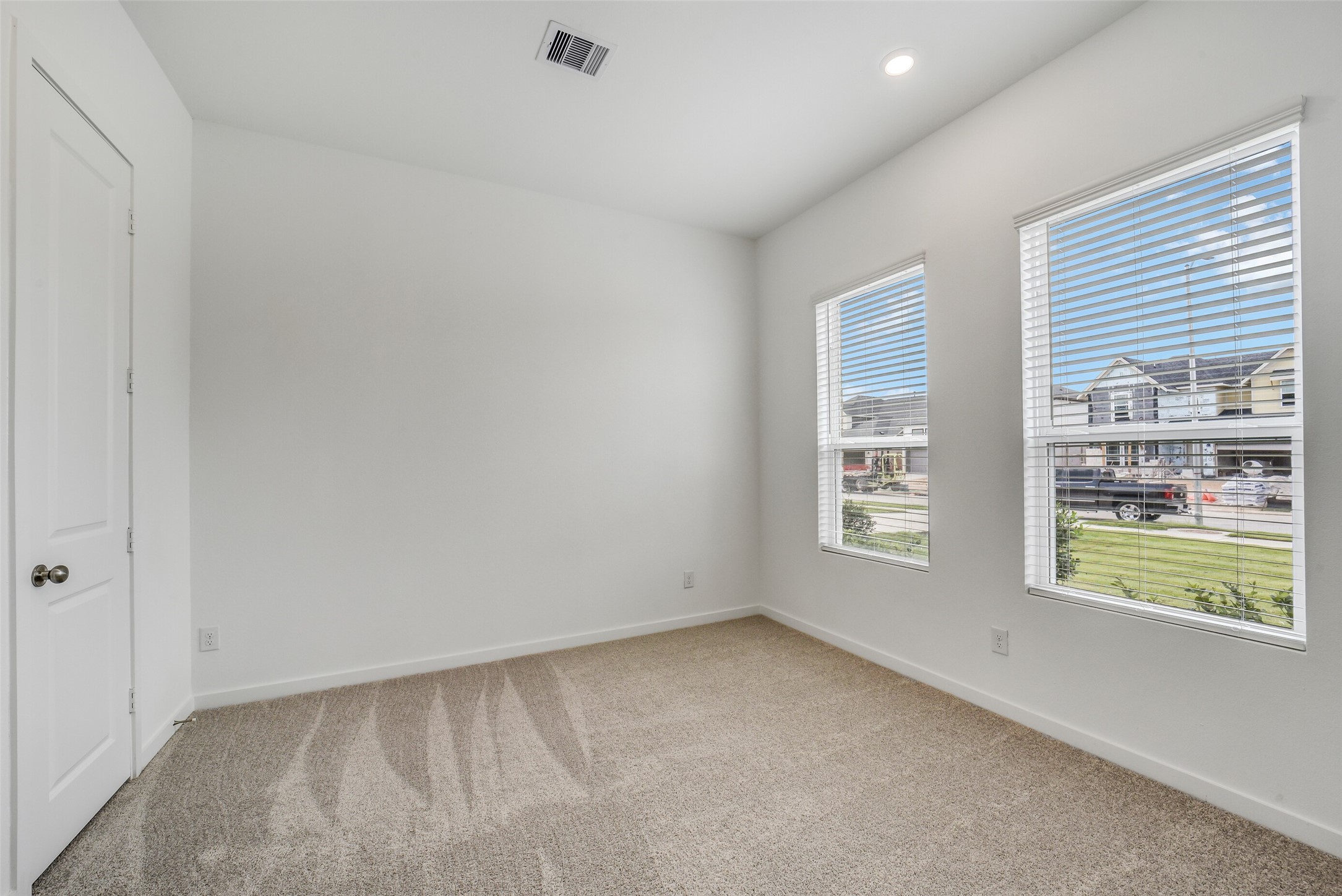 31111 Marlow Mnr Court Fulshear, TX 77441 - Photo 23 of 34 an empty room with windows