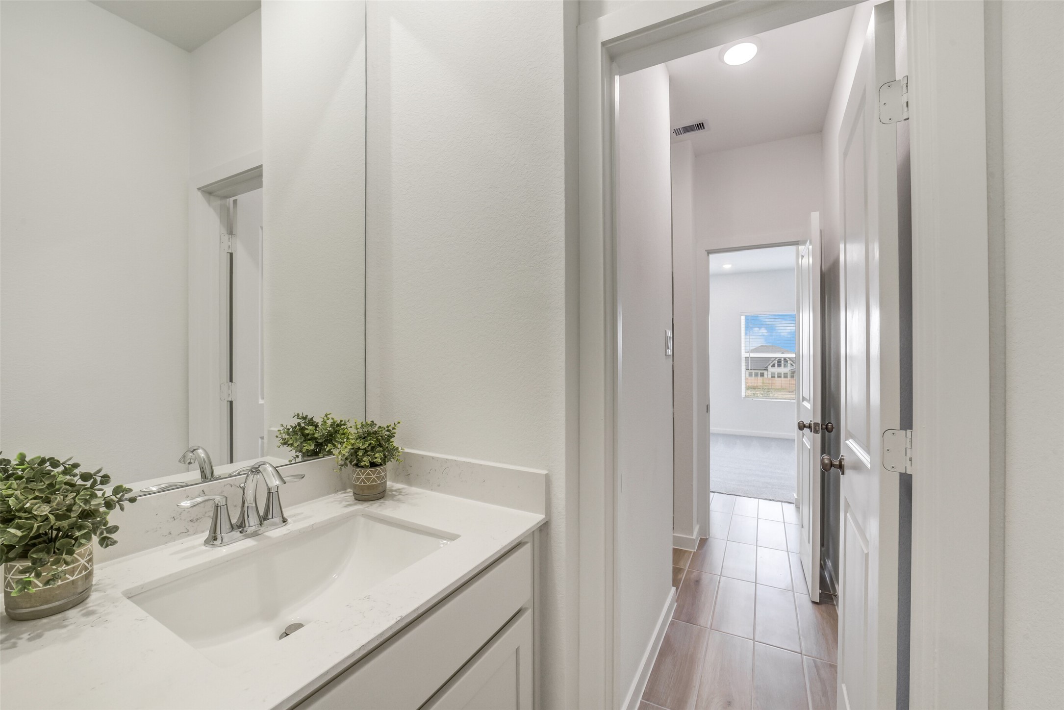 31111 Marlow Mnr Court Fulshear, TX 77441 - Photo 28 of 34 a bathroom with a sink vanity and a mirror