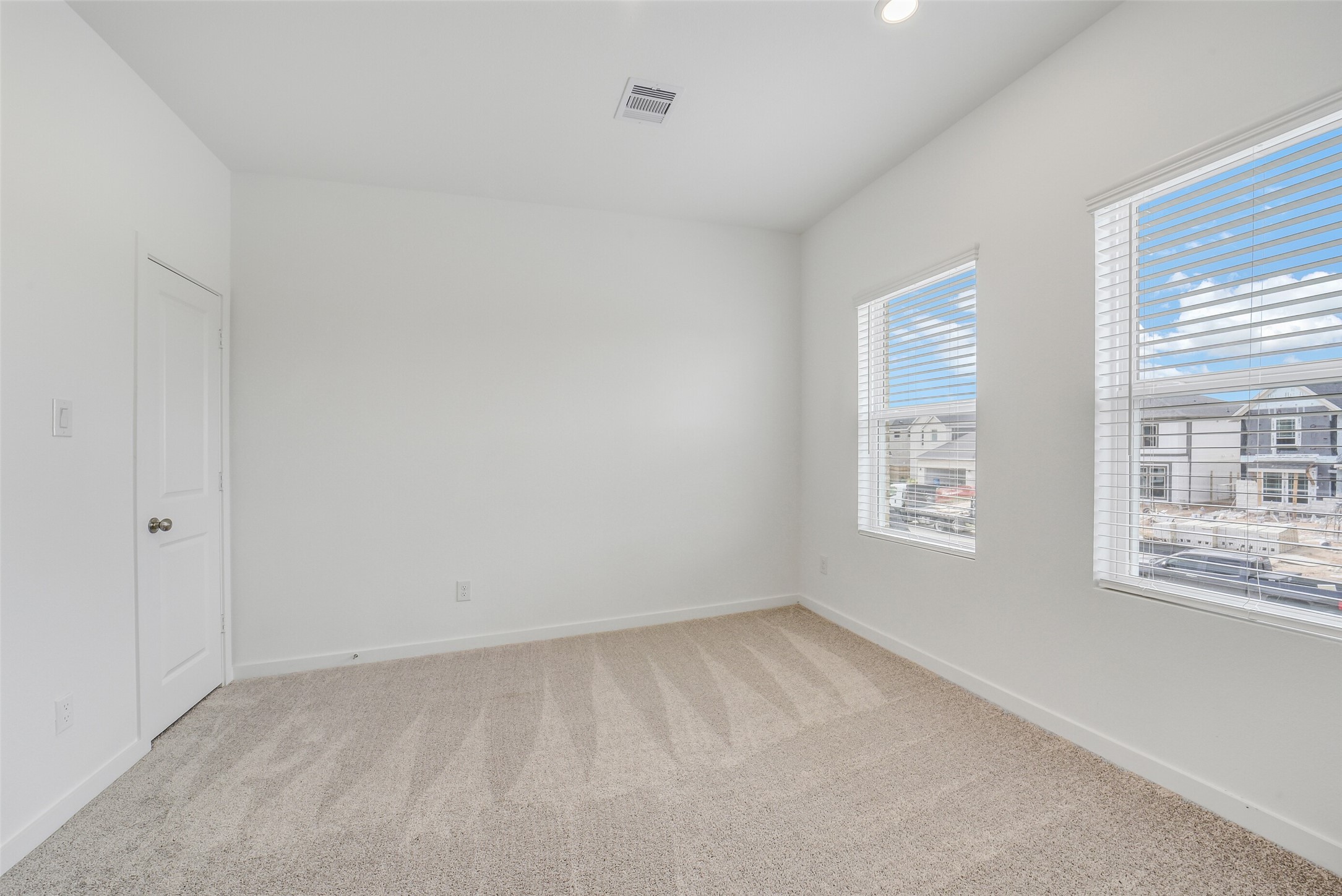 31111 Marlow Mnr Court Fulshear, TX 77441 - Photo 29 of 34 a view of an empty room with a window