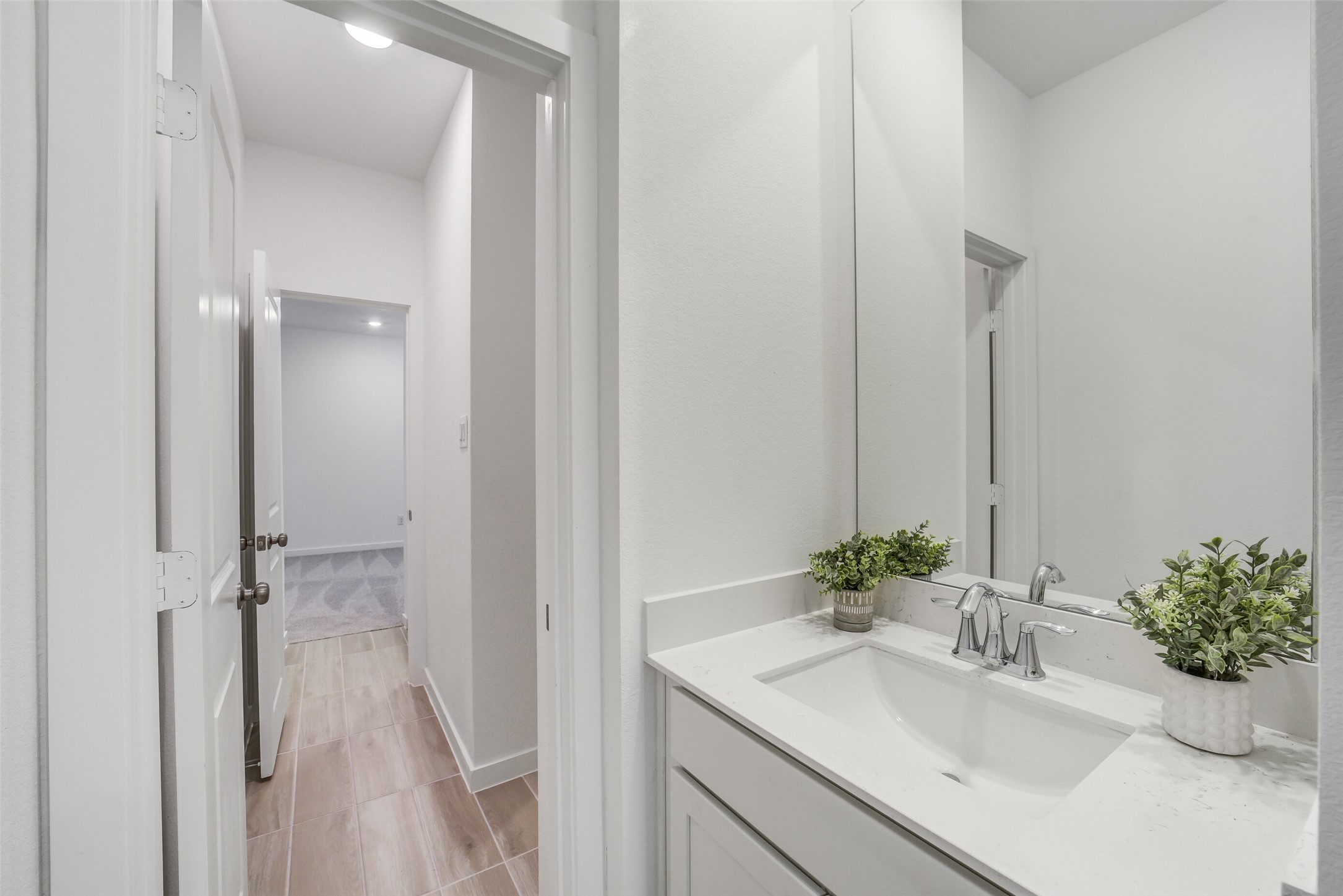 31111 Marlow Mnr Court Fulshear, TX 77441 - Photo 30 of 34 a bathroom with a sink a vanity and a mirror
