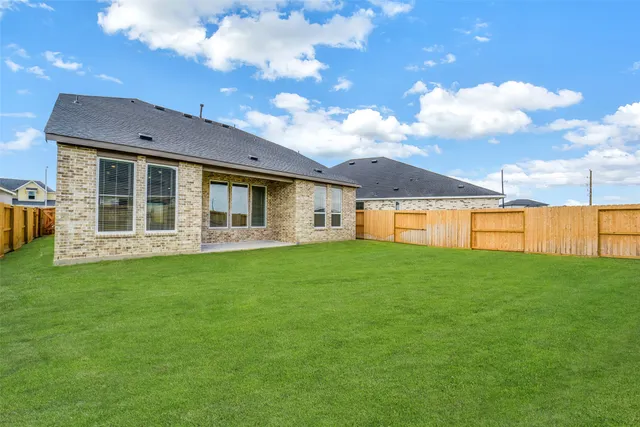 a view of a house with backyard porch and garden
