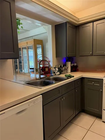 a kitchen with a sink and cabinets