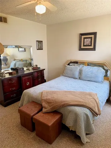 a bedroom with a bed and dresser