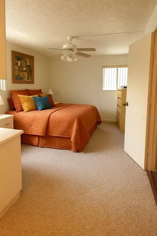 a bed room with bed and window