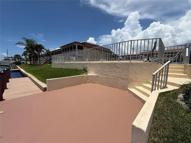 a terrace with wooden floor and city view