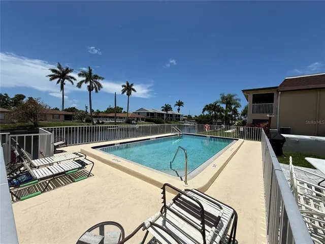 a view of a swimming pool with a lake view