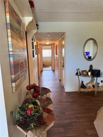 a view of a room with dining area wooden floor a chandelier