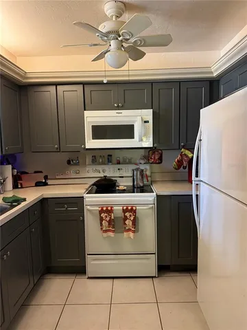 a kitchen with a cabinets and a stove top oven