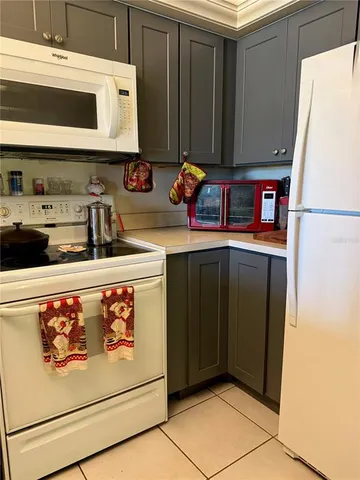 a kitchen with stainless steel appliances a refrigerator and a stove