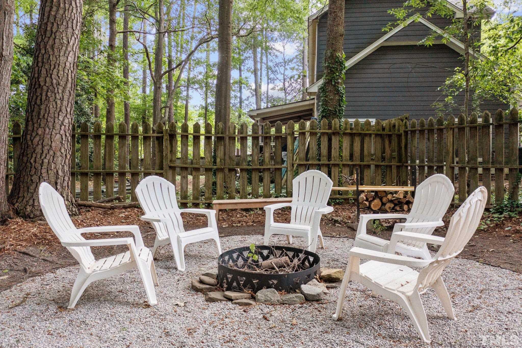 208 Longneedle Court Raleigh, NC 27603 - Photo 23 of 24 a view of a chairs and table in backyard
