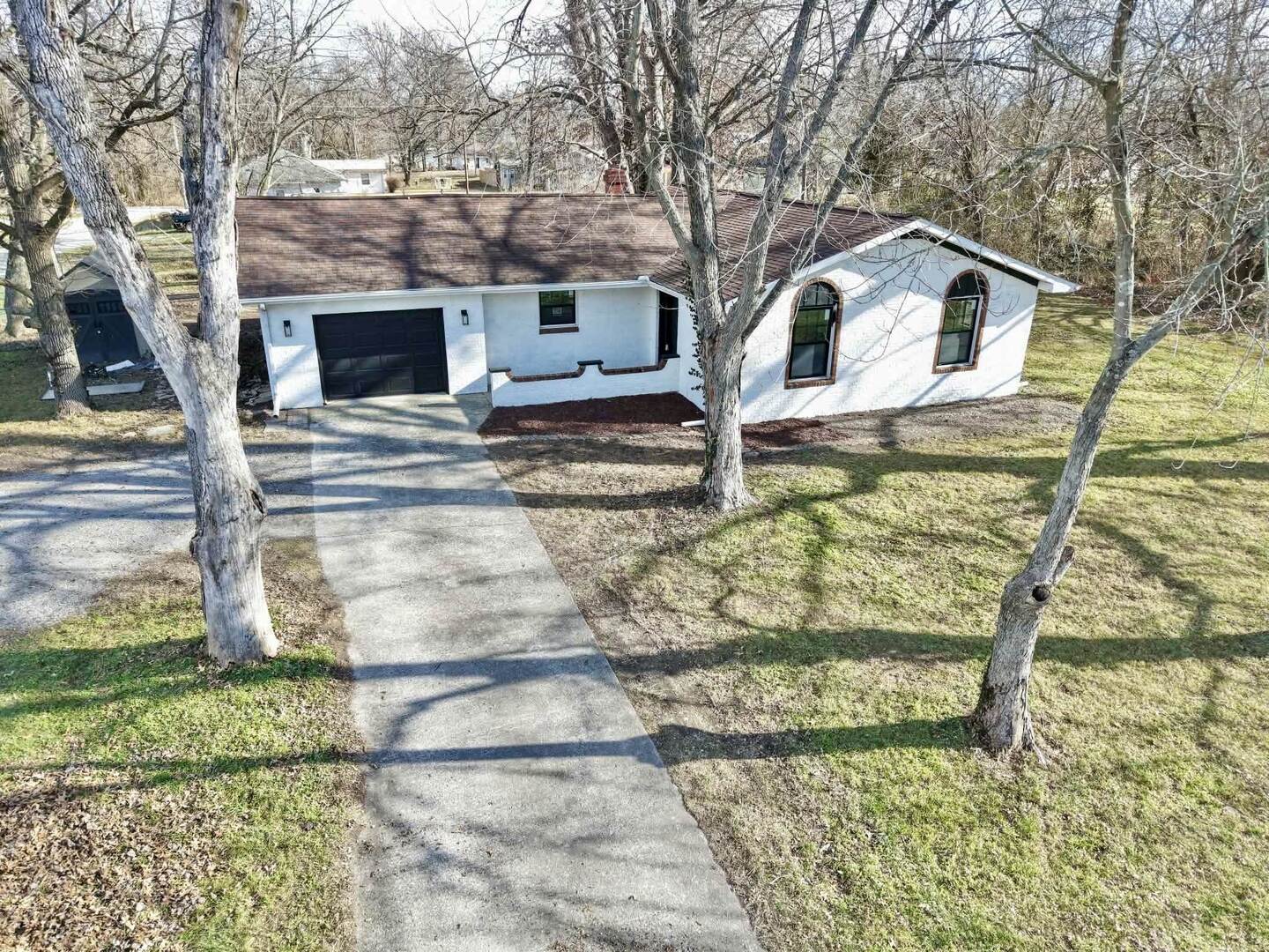 208 North Brown Street Benton, IL 62812 - Photo 11 of 31 a front view of a house with garden