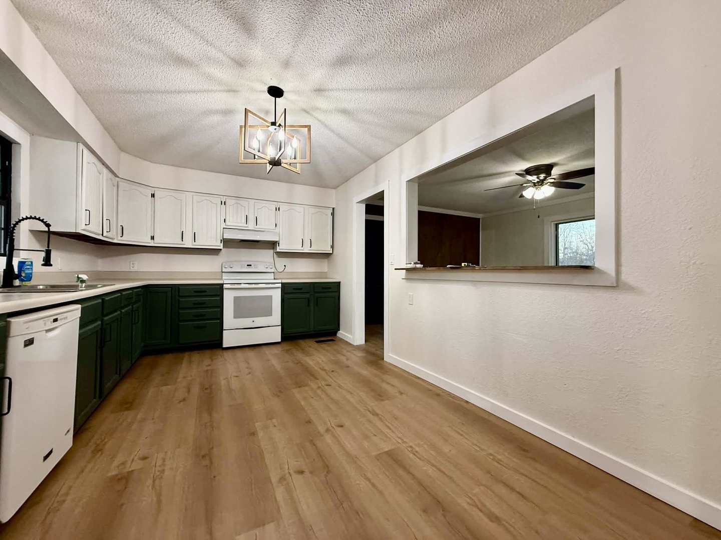 208 North Brown Street Benton, IL 62812 - Photo 22 of 31 a kitchen with granite countertop stainless steel appliances and wooden floor