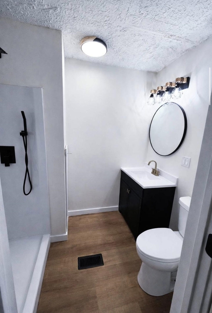 208 North Brown Street Benton, IL 62812 - Photo 25 of 31 a bathroom with a sink a toilet and shower