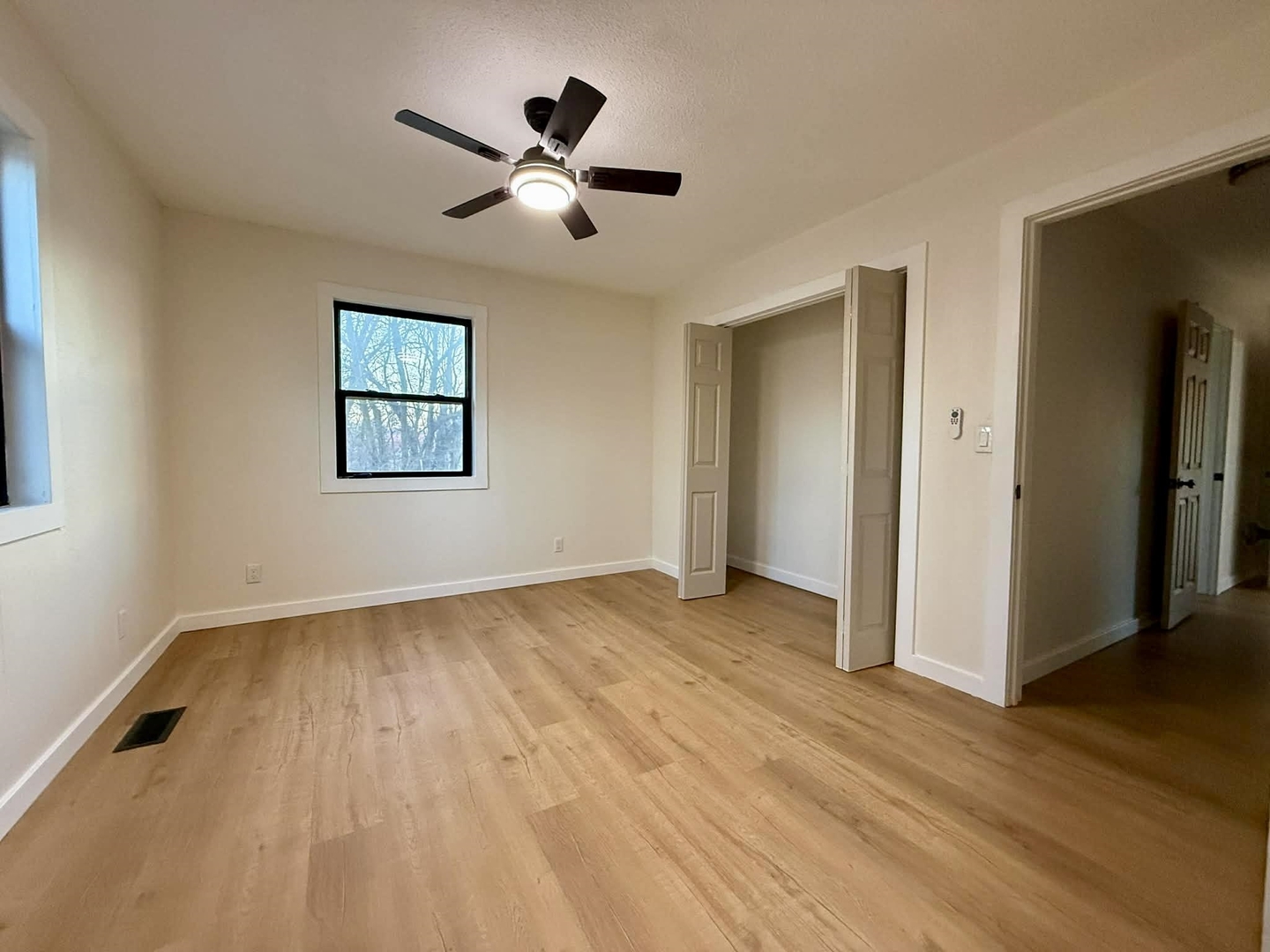 208 North Brown Street Benton, IL 62812 - Photo 29 of 31 a view of an empty room with wooden floor and a window