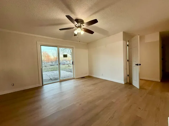 a view of an empty room with a window