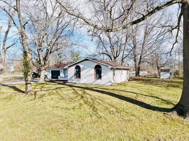 a view of a house with snow on the roof