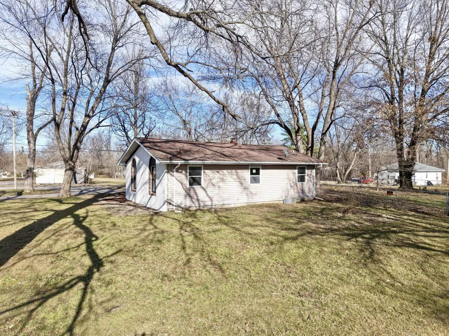 208 North Brown Street Benton, IL 62812 - Photo 8 of 31 a white house that has tree in front of it