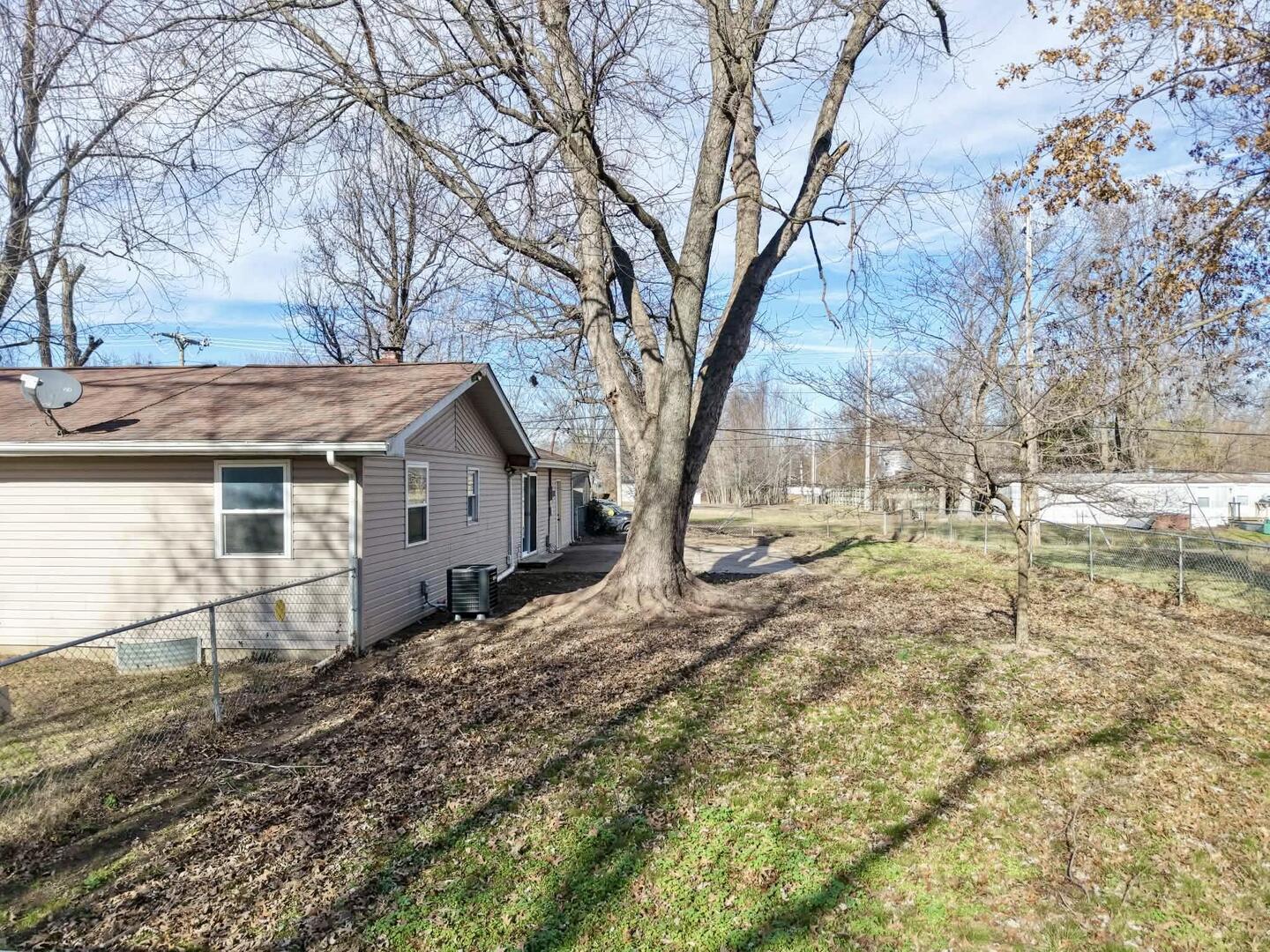 208 North Brown Street Benton, IL 62812 - Photo 9 of 31 a dirt road with large trees