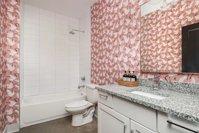 a living room with furniture a flat screen tv and a large window