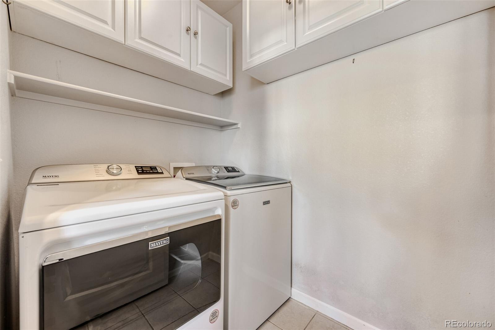 85 Uinta Way, Unit 106 Denver, CO 80230 - Photo 14 of 42 a utility room with dryer and washer