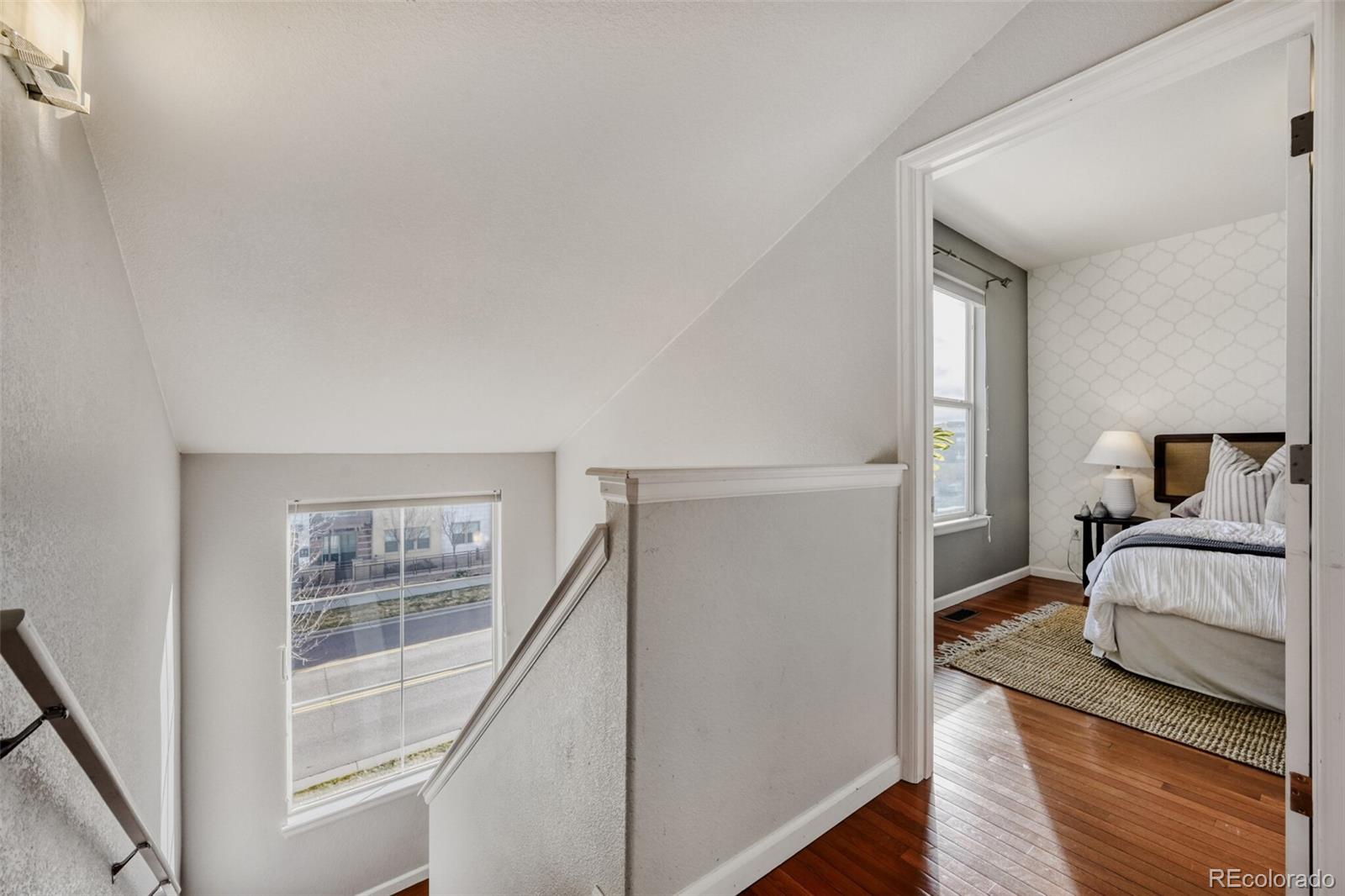 85 Uinta Way, Unit 106 Denver, CO 80230 - Photo 16 of 42 a living room with furniture and a window