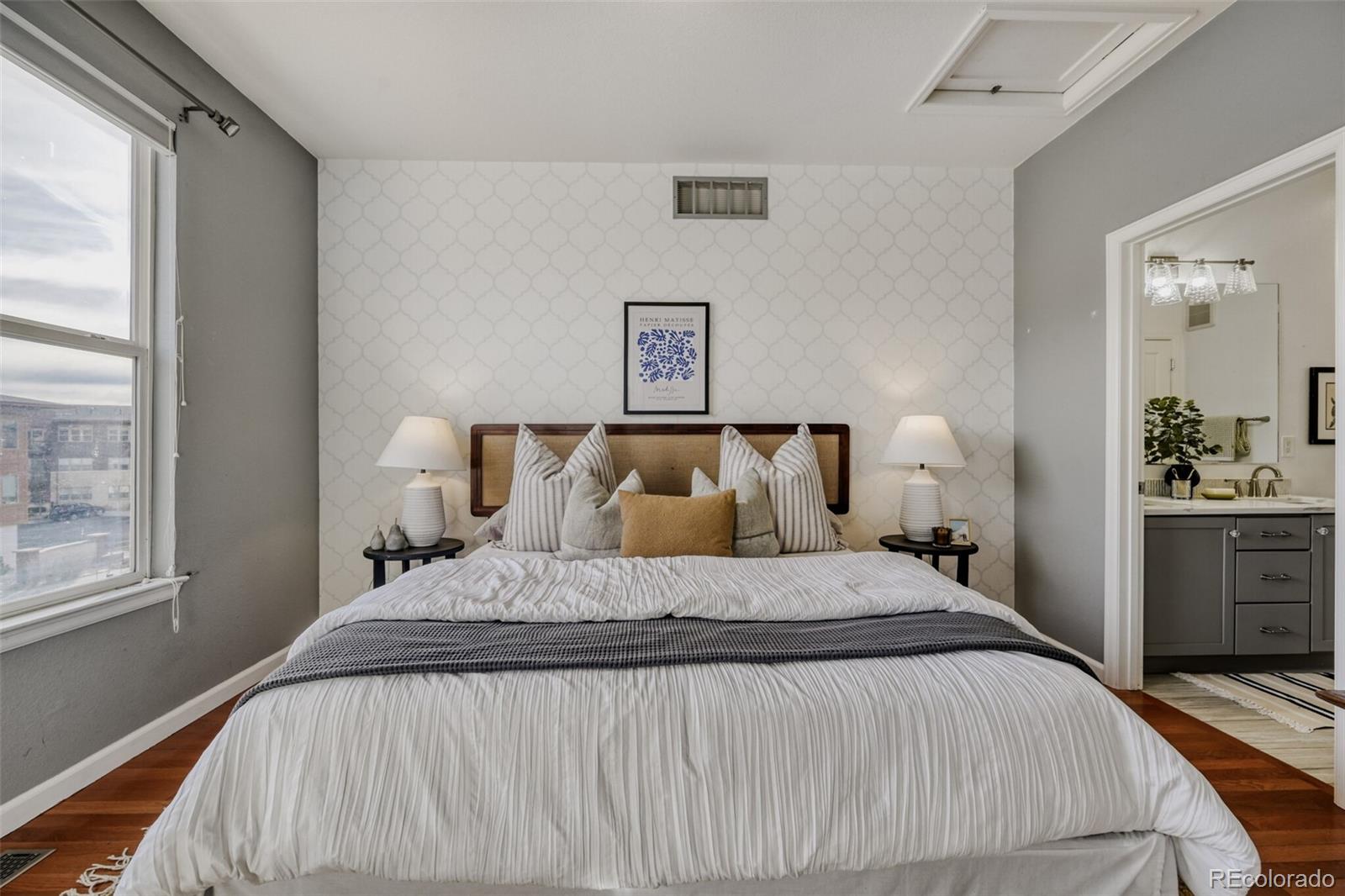 85 Uinta Way, Unit 106 Denver, CO 80230 - Photo 19 of 42 a bedroom with a bed and window