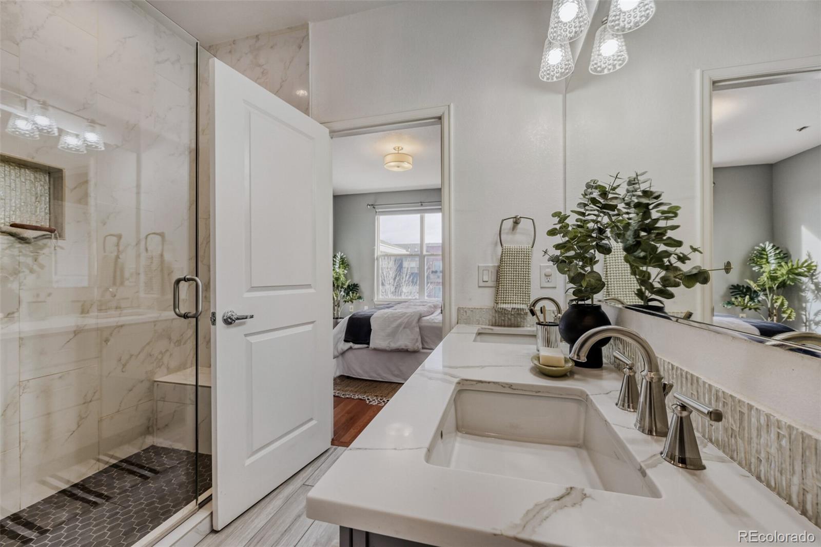 85 Uinta Way, Unit 106 Denver, CO 80230 - Photo 20 of 42 a living room with furniture and a potted plant