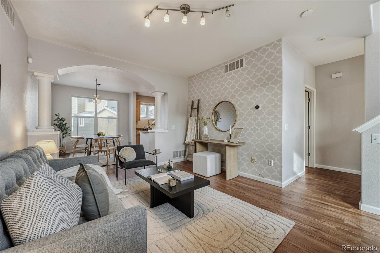 85 Uinta Way, Unit 106 Denver, CO 80230 - Photo 2 of 42 a living room with furniture and a window