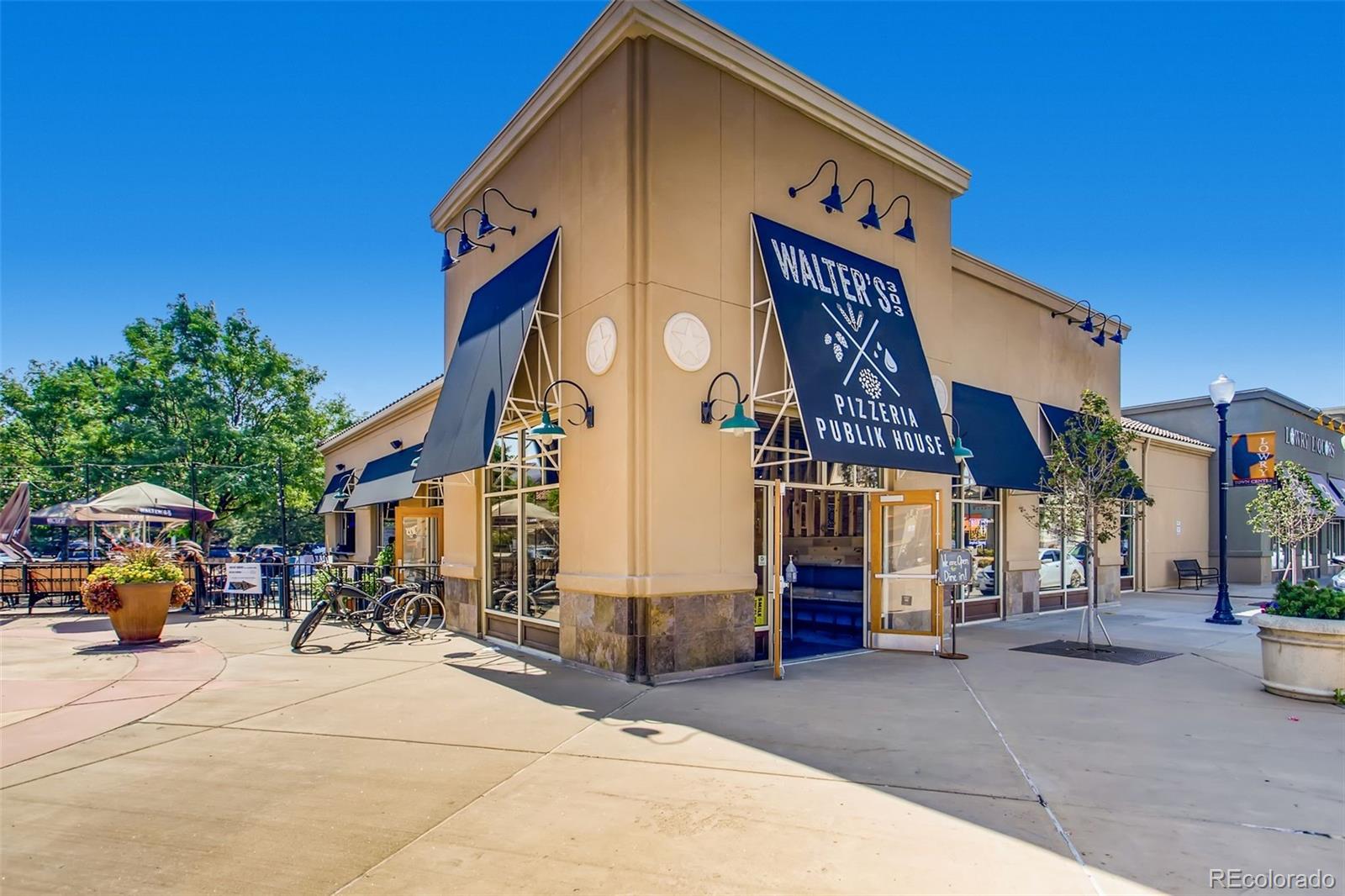 85 Uinta Way, Unit 106 Denver, CO 80230 - Photo 36 of 42 a front view of a building with streets and trees