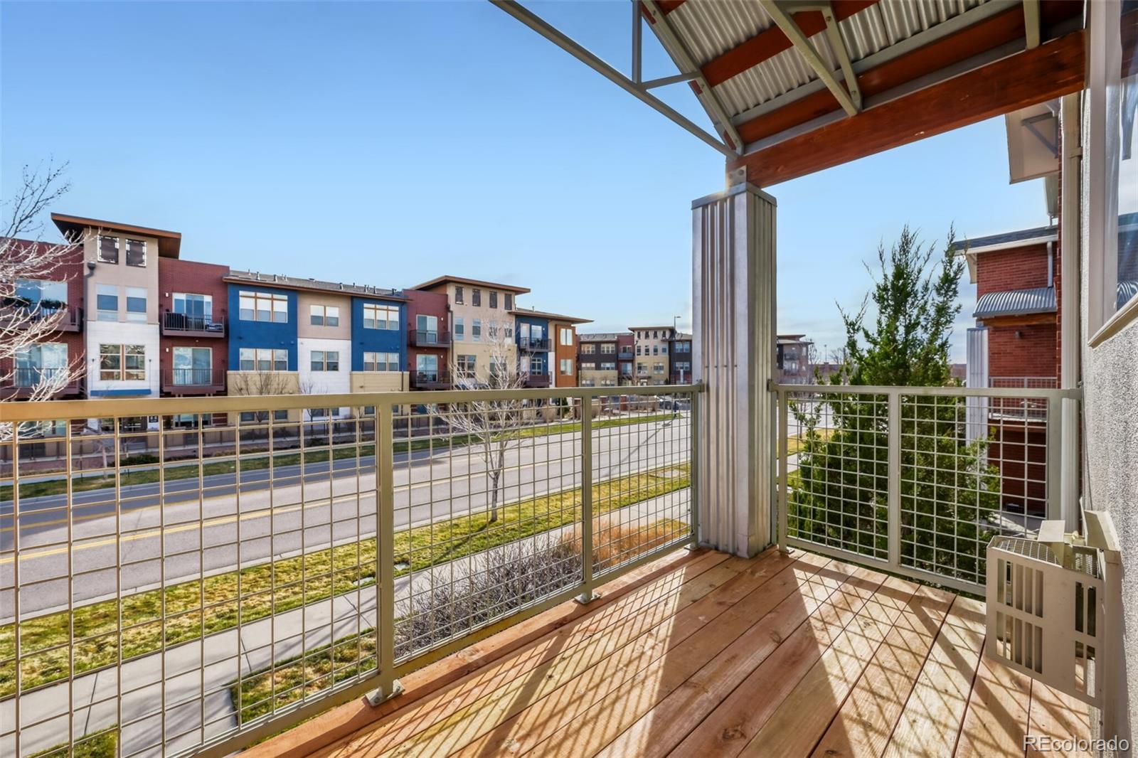 85 Uinta Way, Unit 106 Denver, CO 80230 - Photo 7 of 42 a view of balcony with wooden floor