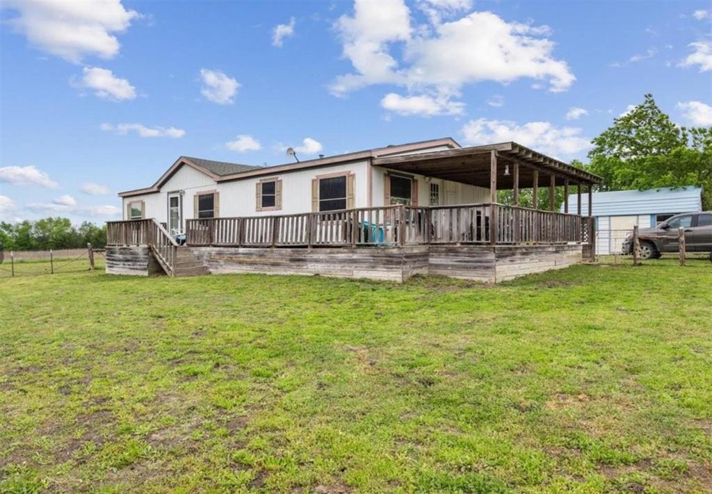 7141 County Road 1050 Celeste, TX 75423 - Photo 17 of 32 a front view of a house with garden