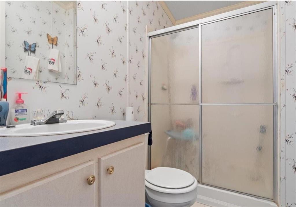 7141 County Road 1050 Celeste, TX 75423 - Photo 20 of 32 a bathroom with a sink a toilet and shower