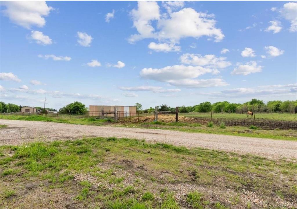 7141 County Road 1050 Celeste, TX 75423 - Photo 24 of 32 a view of a big yard with table and chairs