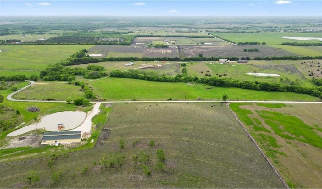 7141 County Road 1050 Celeste, TX 75423 - Photo 28 of 32 an aerial view of a house with a yard