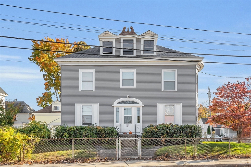 276 Pine Street Lowell, MA 01851 - Photo 2 of 42 a front view of a house with garden