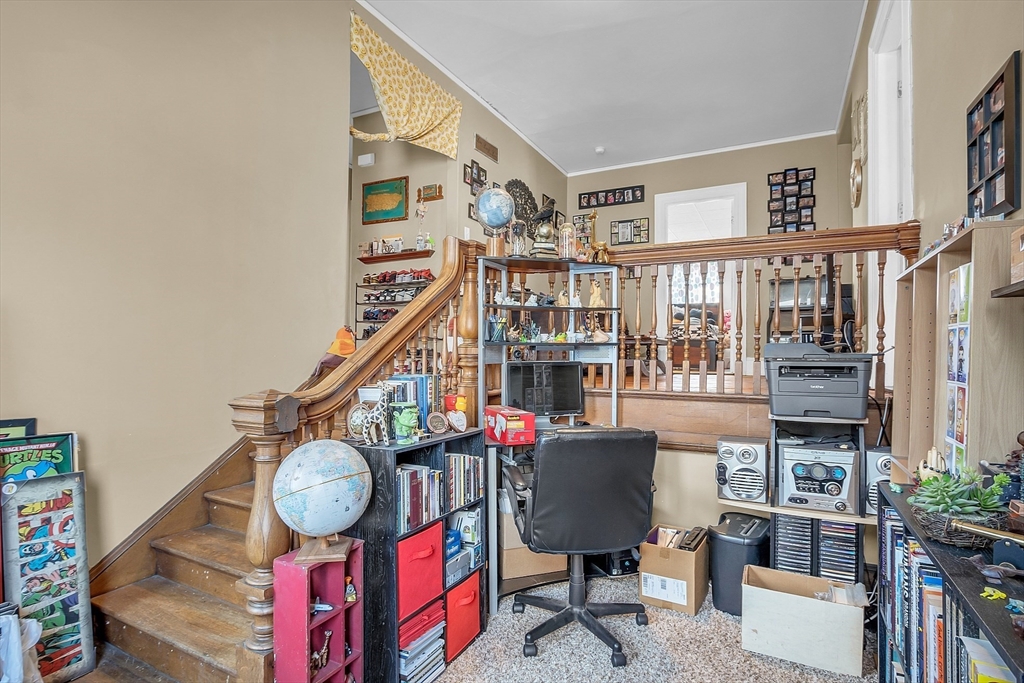 276 Pine Street Lowell, MA 01851 - Photo 24 of 42 a view of a livingroom with furniture staircase and a potted plant