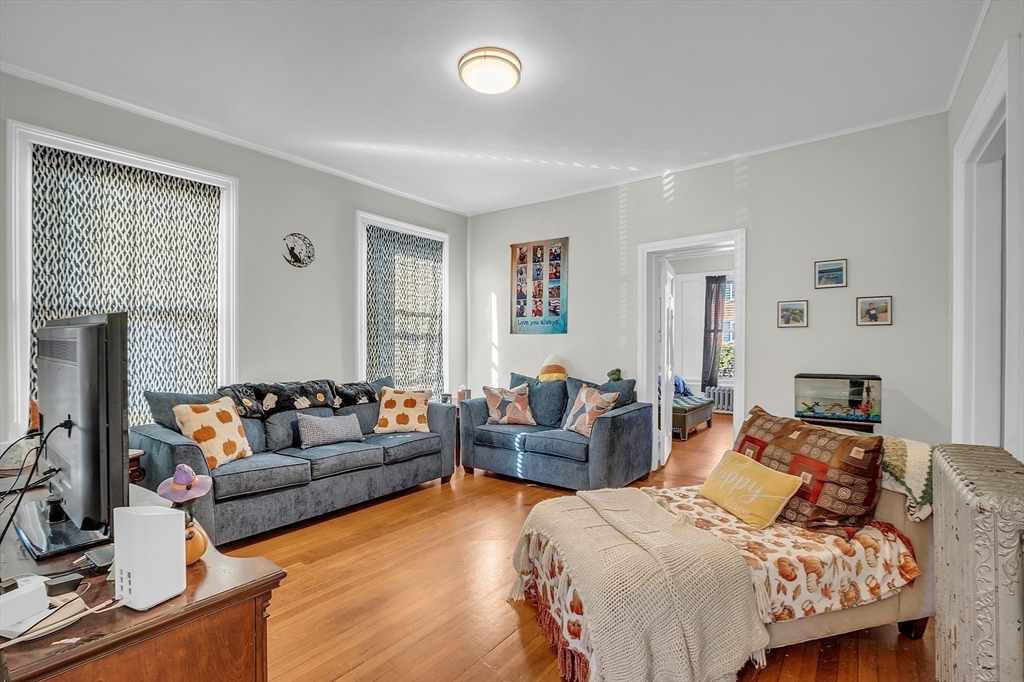 276 Pine Street Lowell, MA 01851 - Photo 5 of 42 a living room with furniture and a large window