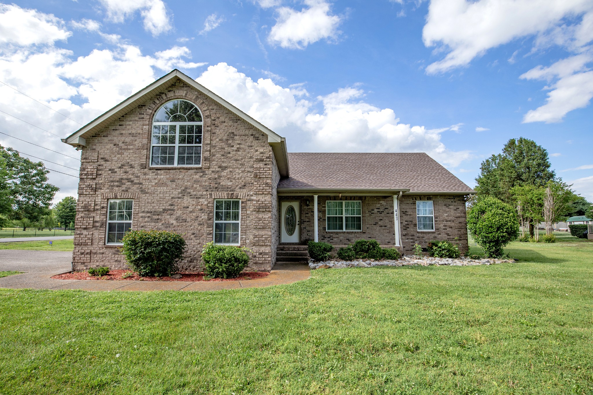 443 Clearview Road Cottontown, TN 37048 - Photo 1 of 21 a front view of a house with garden