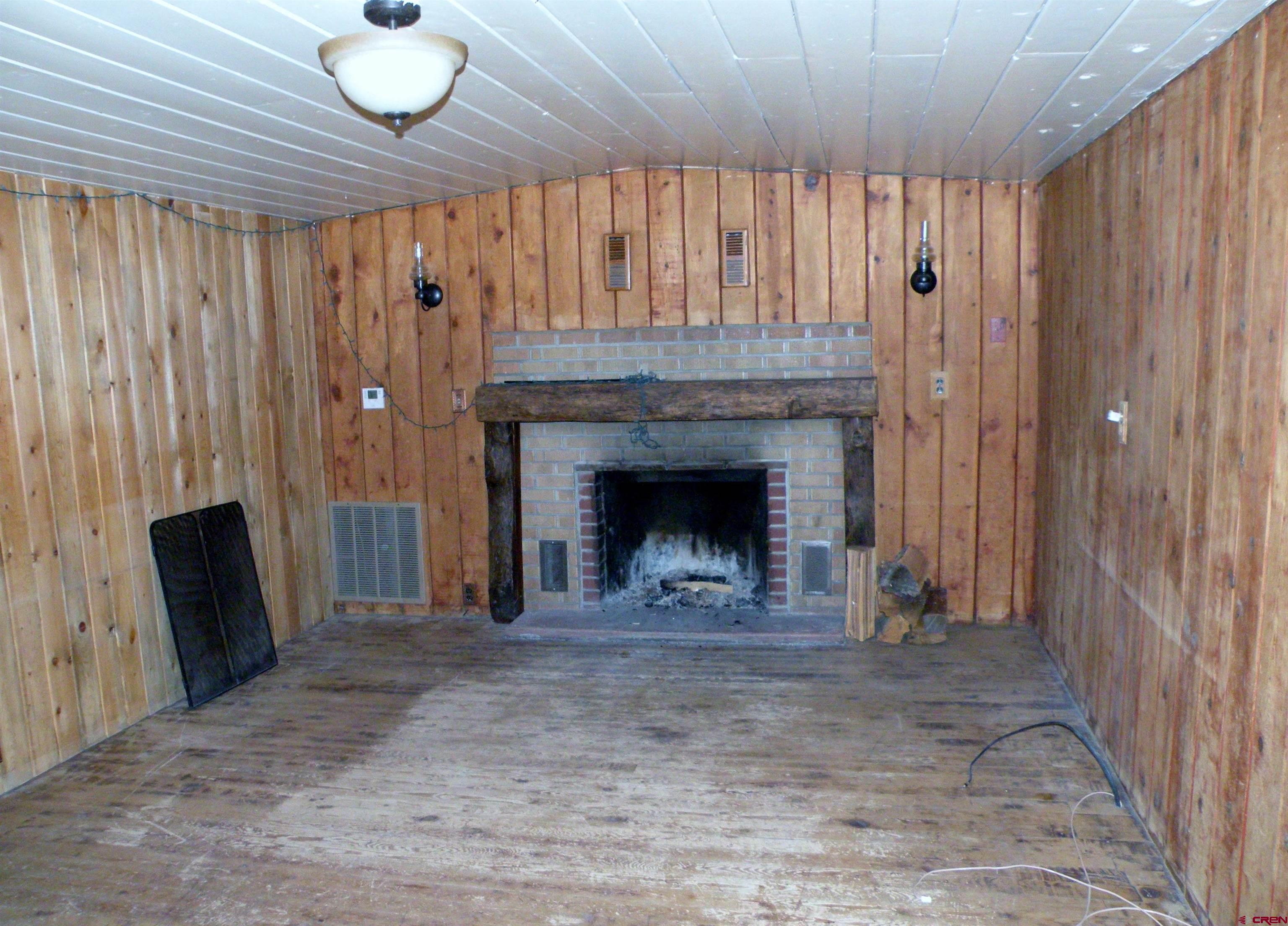 27793 BB Road Nucla, CO 81424 - Photo 11 of 18 a view of an empty room with a fireplace