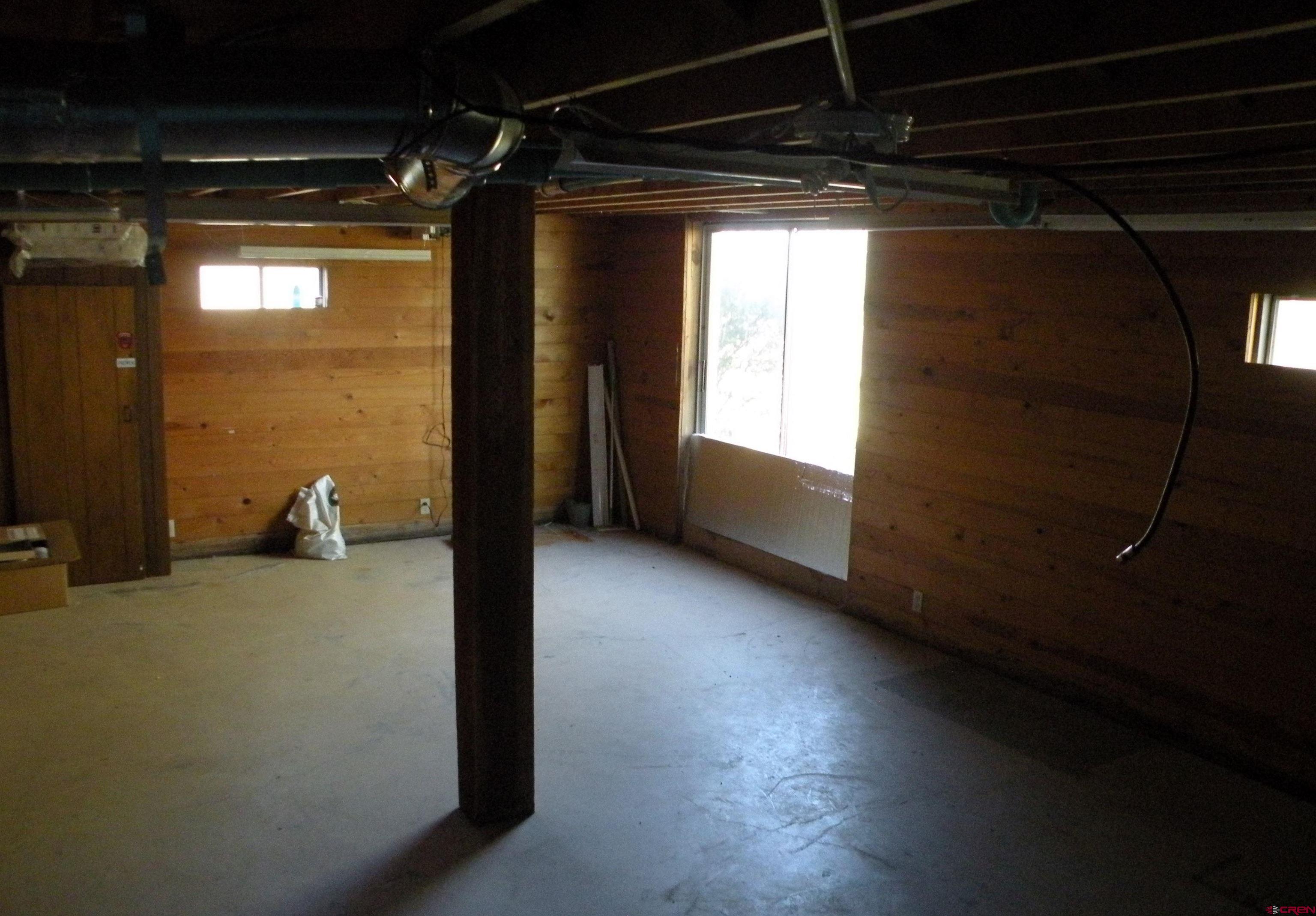 27793 BB Road Nucla, CO 81424 - Photo 18 of 18 a view of a room with wooden floor and windows
